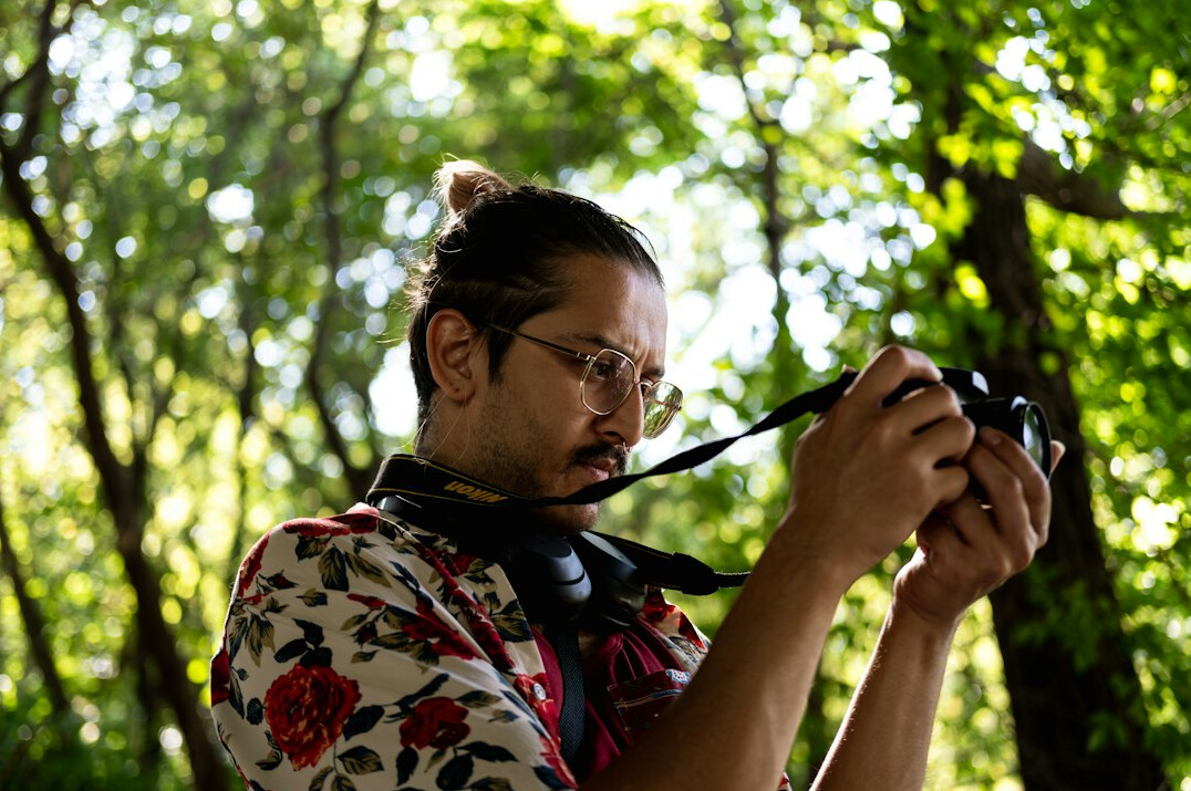 Portrait of a man photographer with a camera around his neck